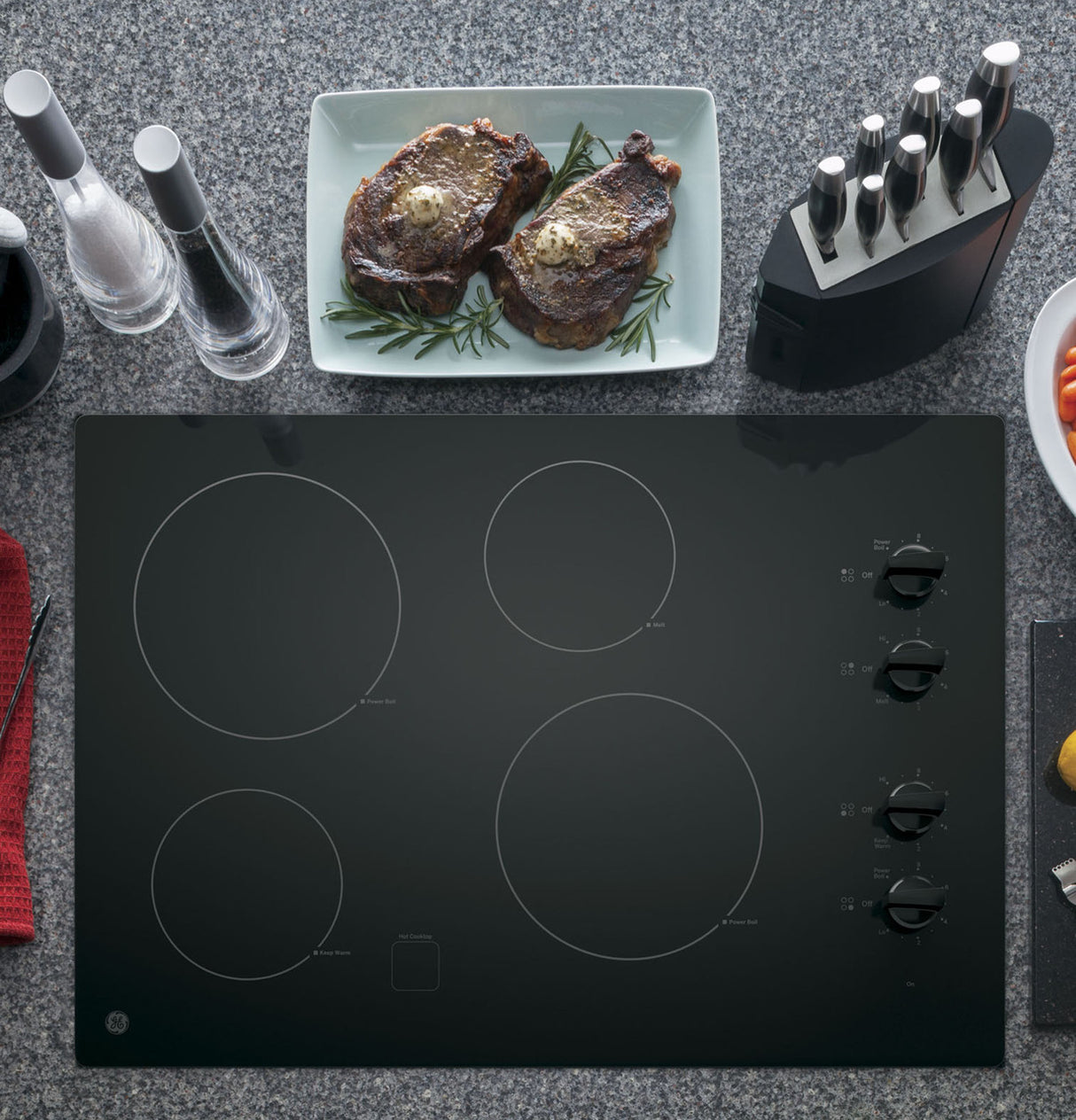 GE JP3030DWBB electric cooktop — knob controls