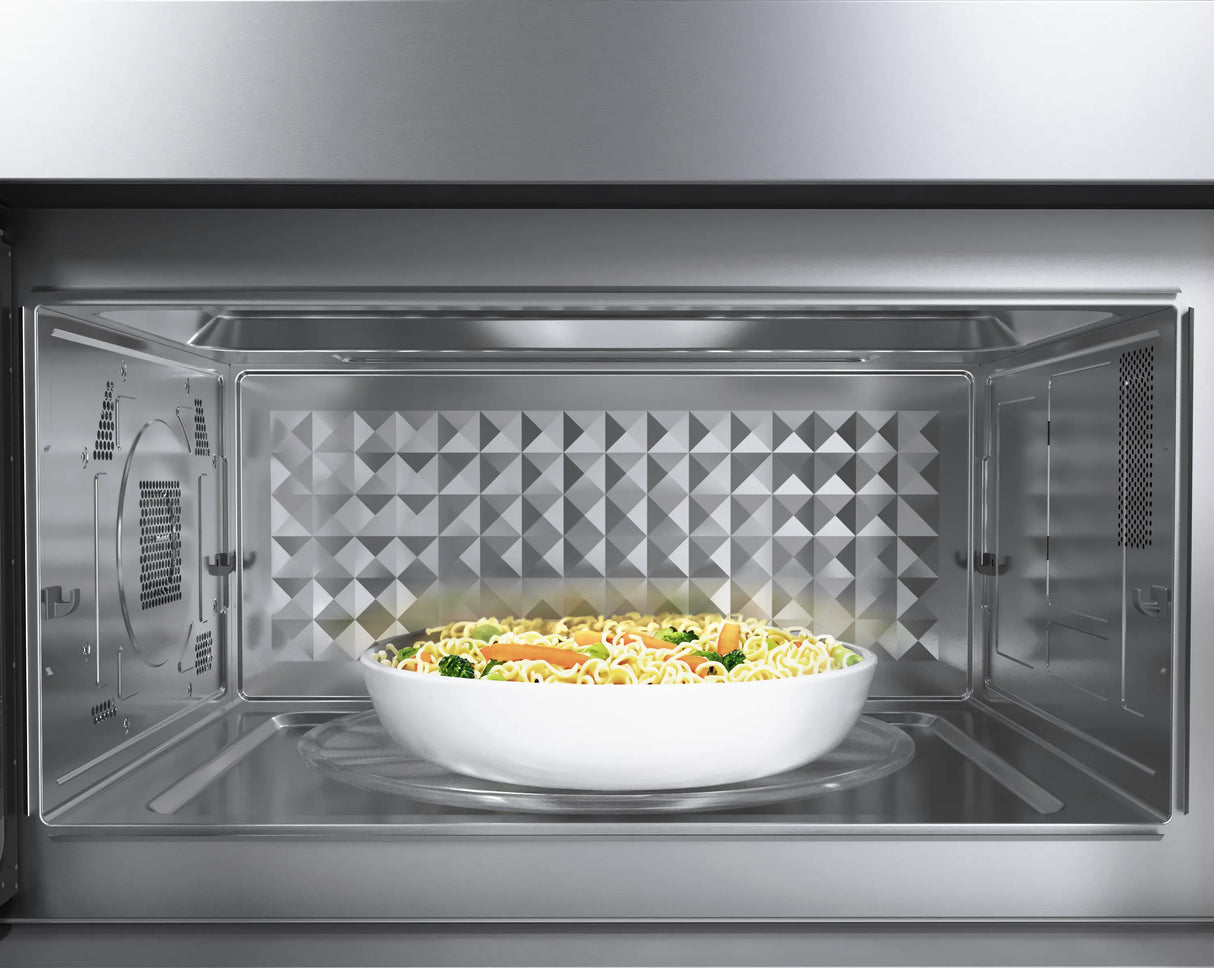 Bosch HMV8054U over-the-range microwave interior with food
