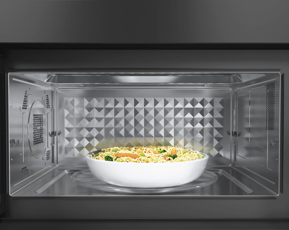 Bosch HMV8045U over-the-range microwave door open with food