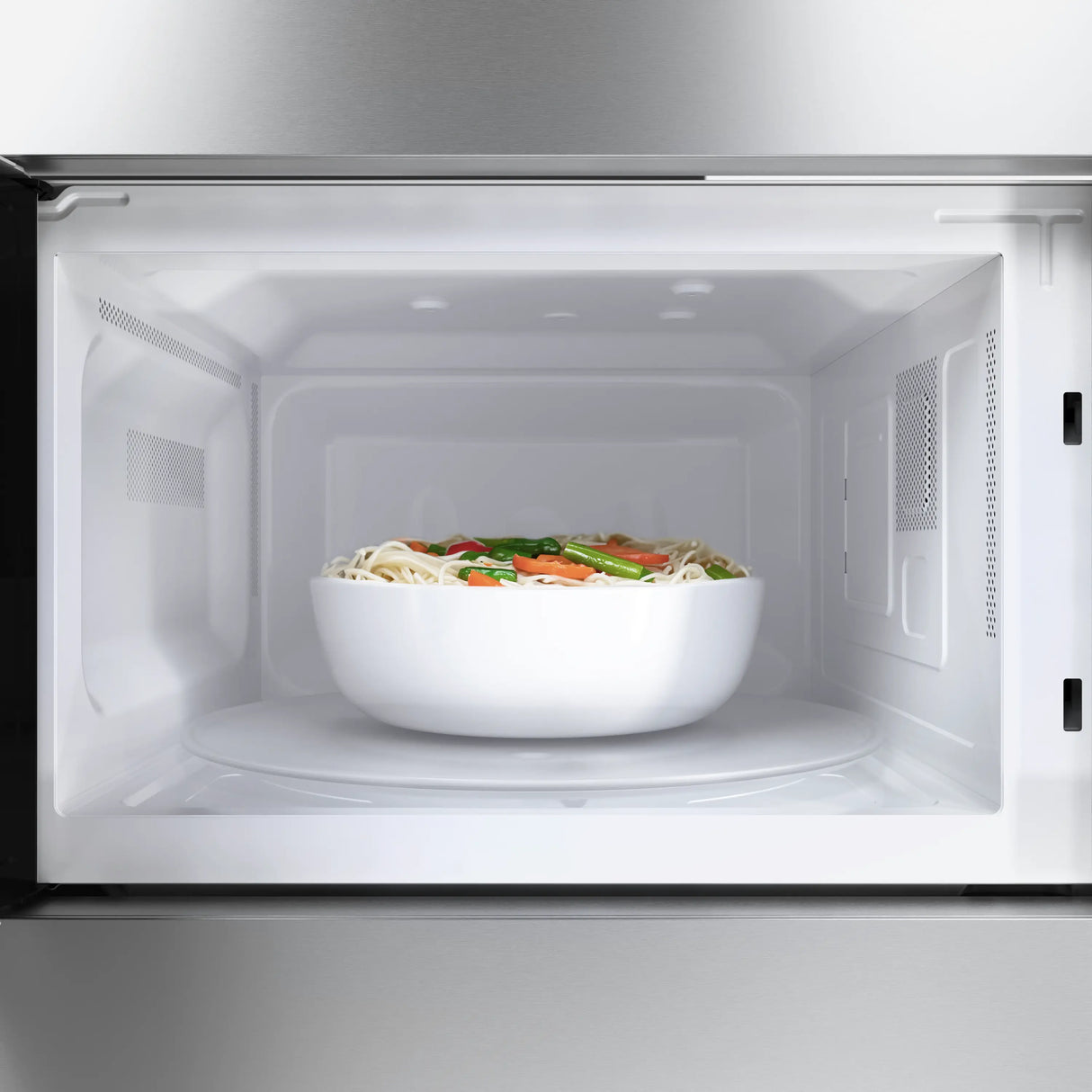 Bosch HMB30155UC built-in microwave oven with food inside