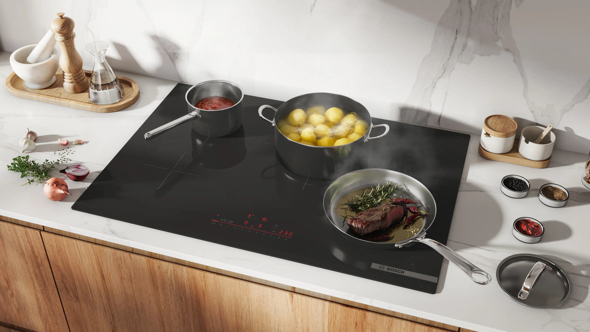 Bosch NIT8061UC induction cooktop AutoChef in use