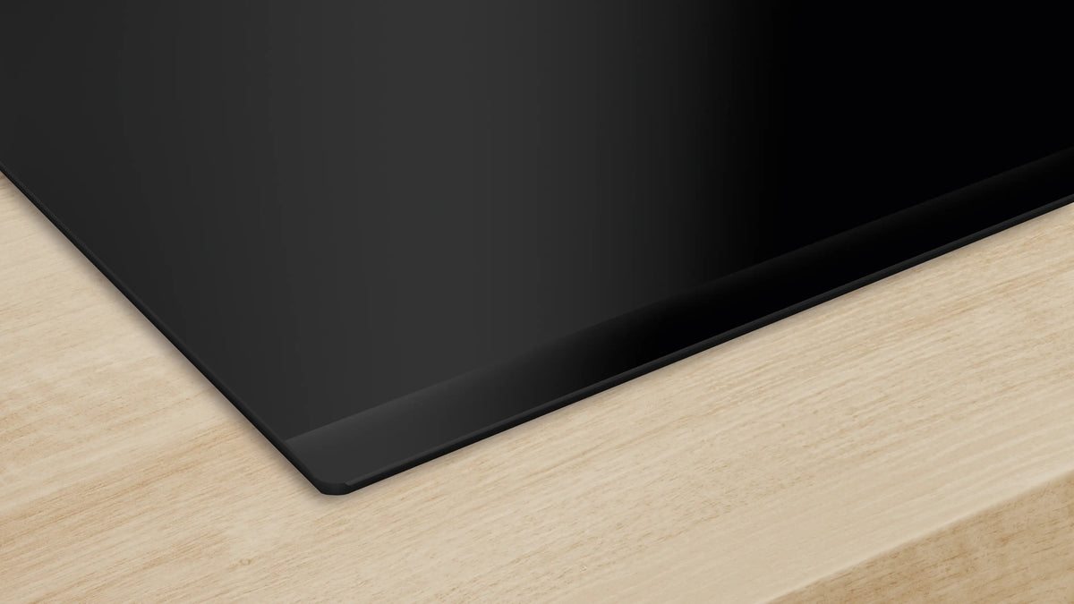 Bosch NIT8661UC induction cooktop black bevel corner detail