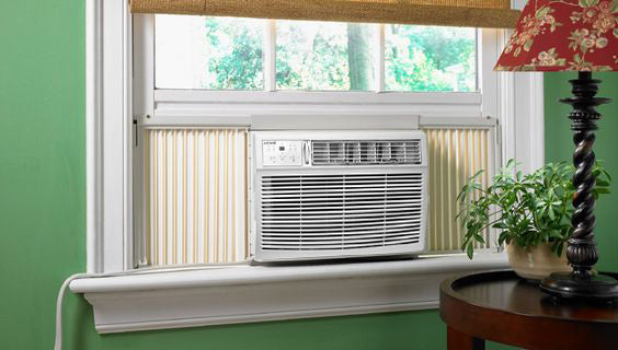 Bevoi BEV25WINMID 25,000 BTU window air conditioner in white – installed in a living room window