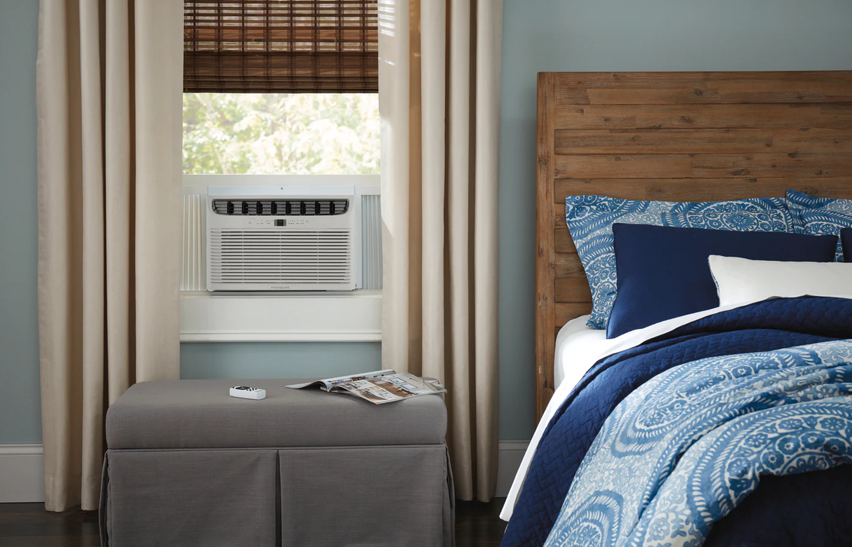 Frigidaire FFRE153WAE 15,100 BTU Window-Mounted Air Conditioner installed in a bedroom window