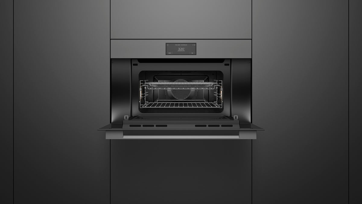 Fisher & Paykel OM30NMUG3 Minimal Compact Convection-Speed Oven installed, angled kitchen view