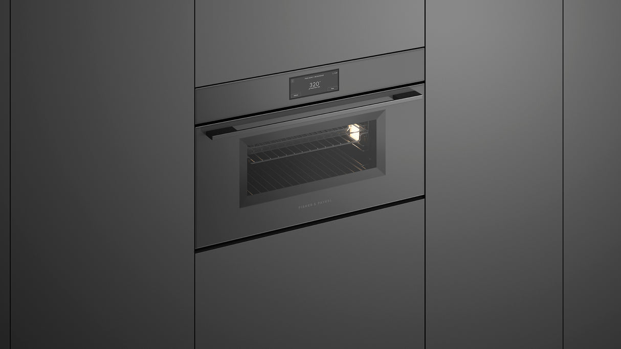 Fisher & Paykel OM30NMUG3 Minimal Compact Convection-Speed Oven installed in kitchen, lights on