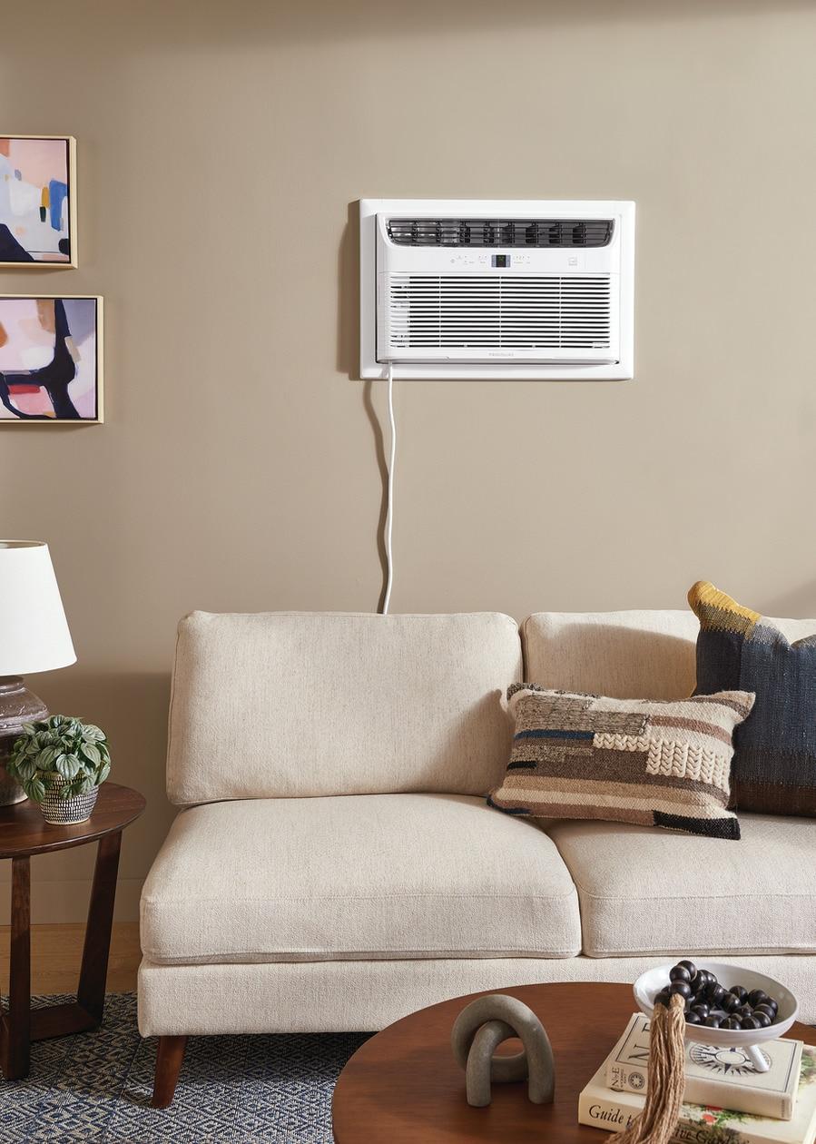 Frigidaire 14,000 BTU built-in room air conditioner installed on a living room