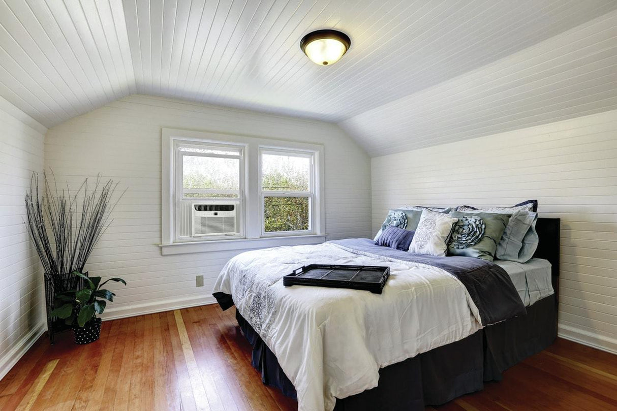 Frigidaire 12,000 BTU window air conditioner installed in a bedroom window