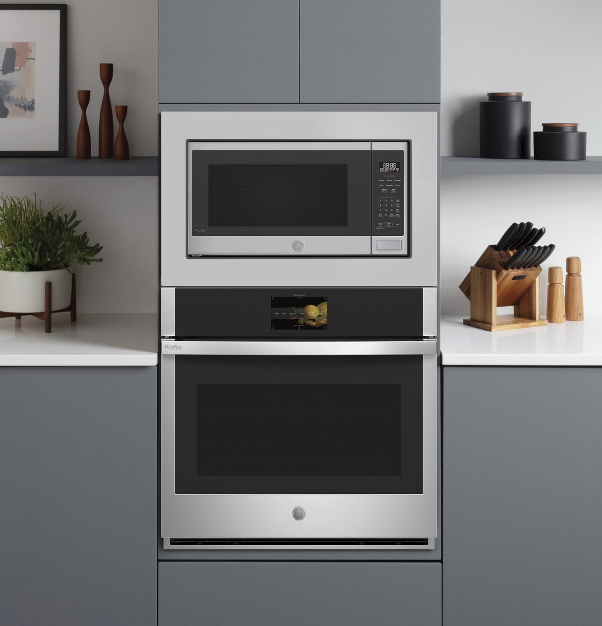 GE Profile PCWK22U1WSS microwave with trim kit over wall oven