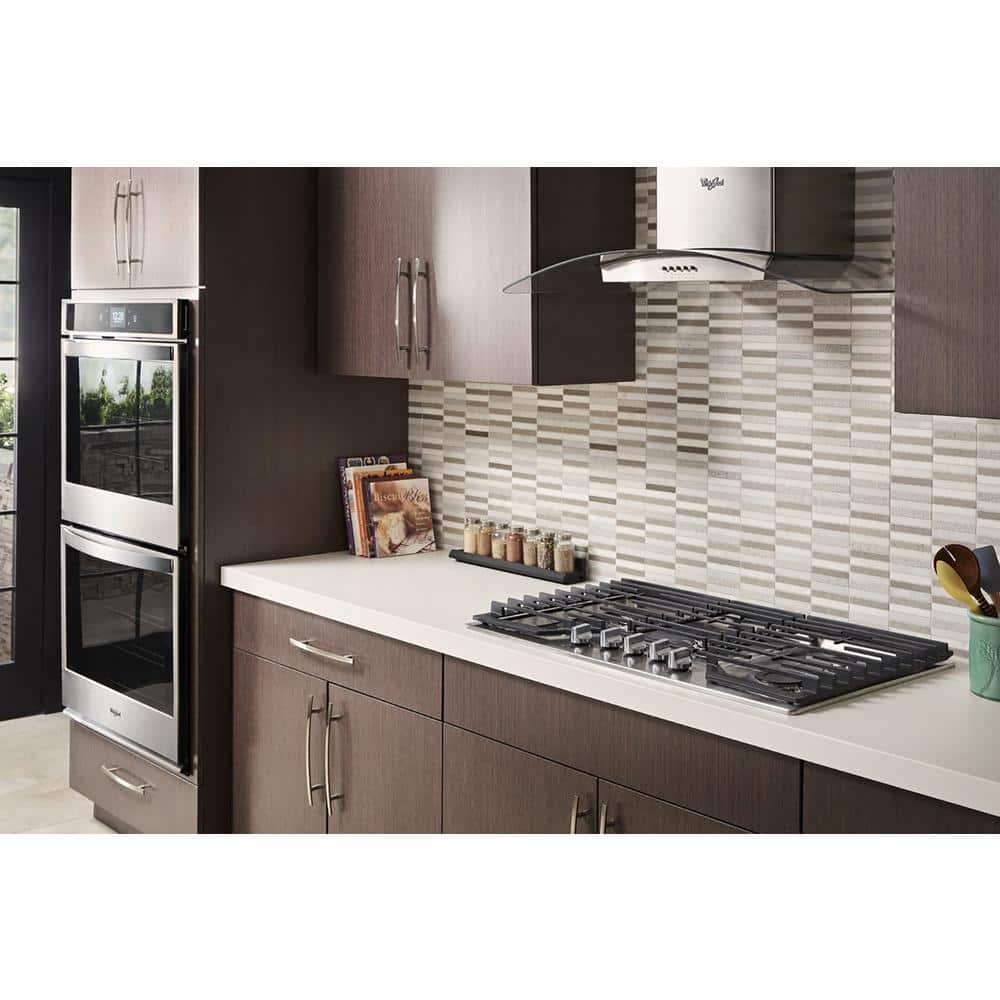 Whirlpool WVW75UC6DS stainless glass wall range hood installed