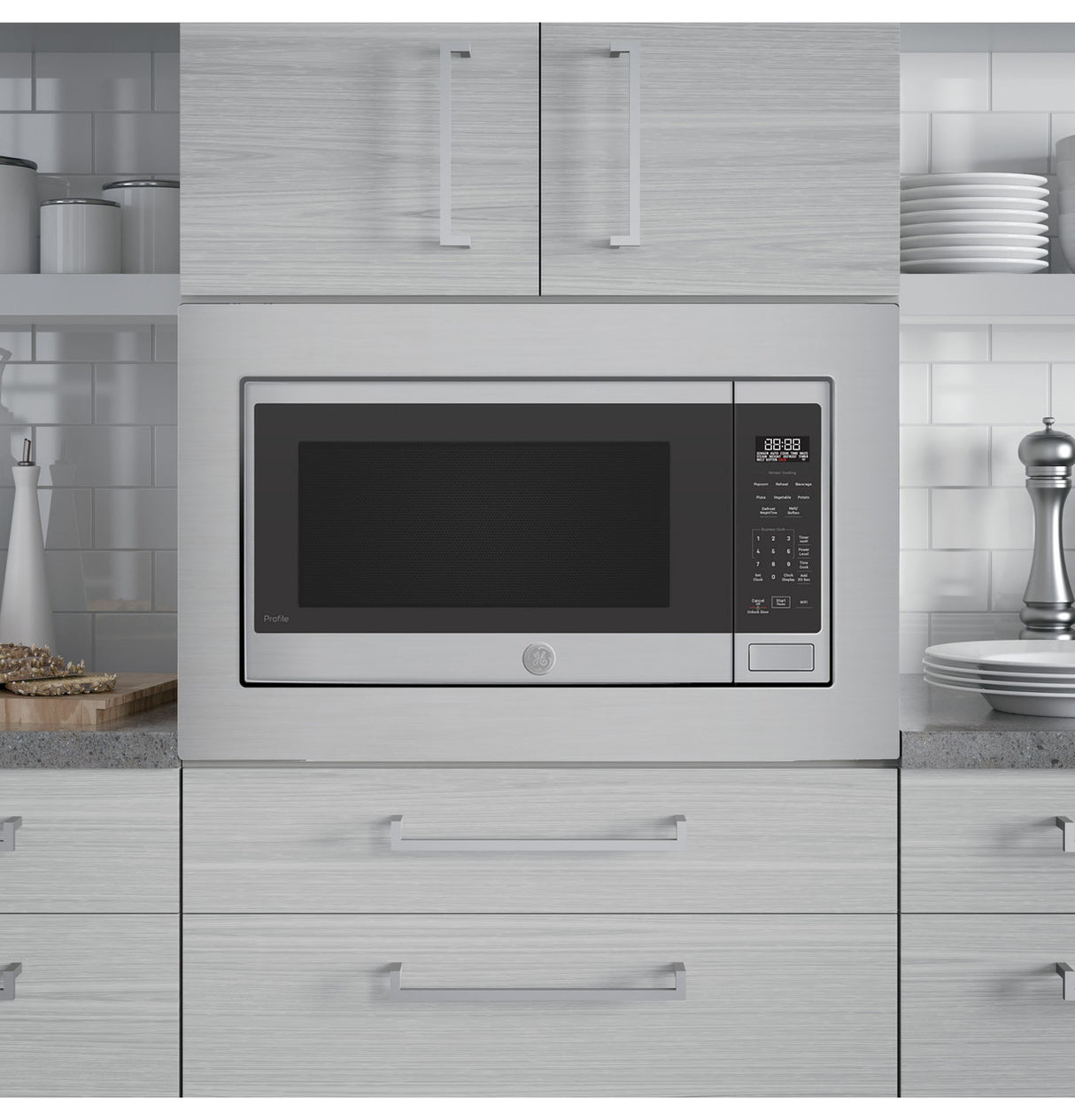 GE Profile PCWK22U1WSS microwave installed in a kitchen cabinet