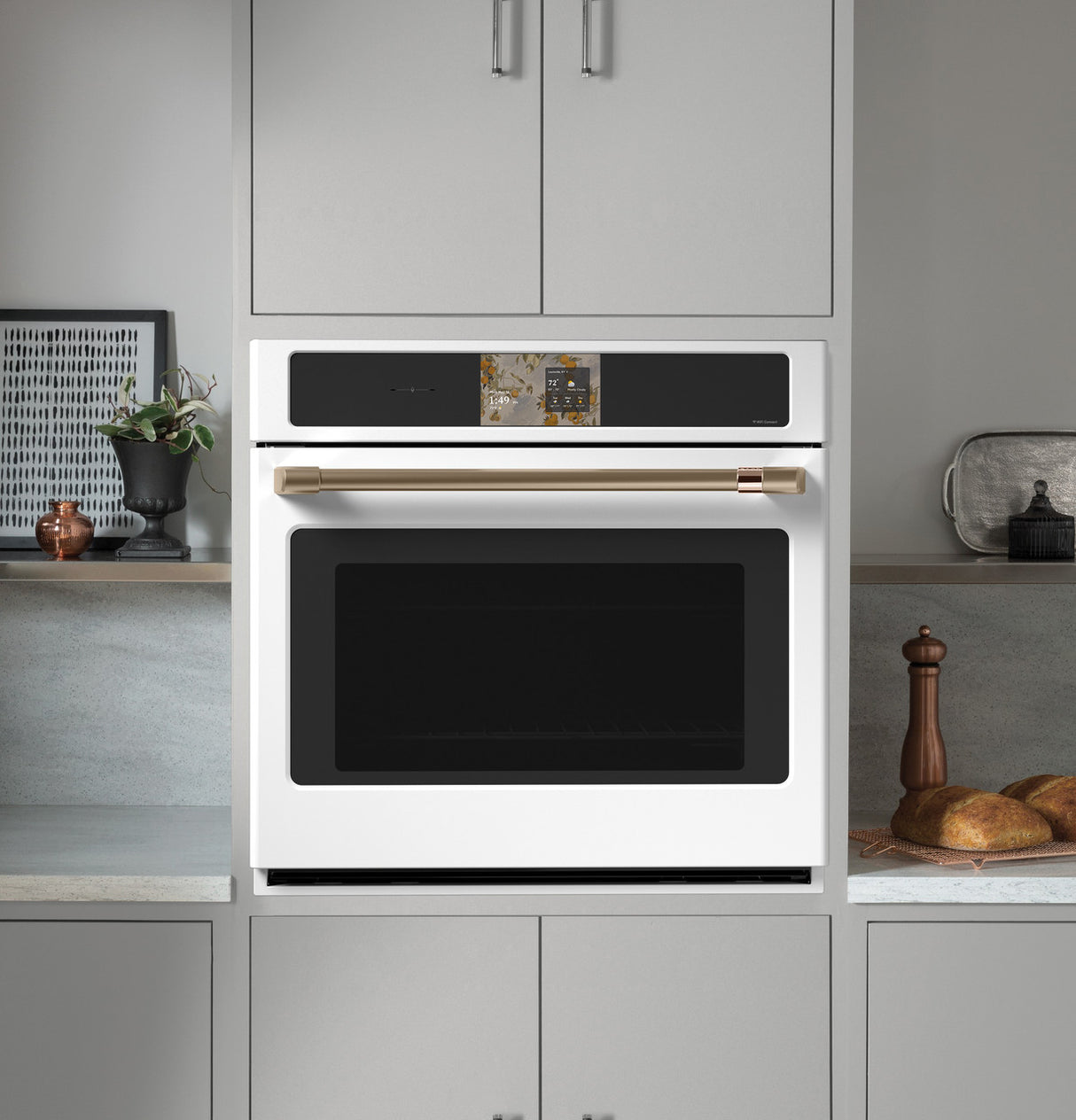 Café CTS90DP4ZW2 single wall oven with door open showing interior racks