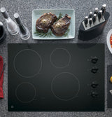GE JP3030DWBB electric cooktop — knob controls