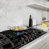 Bosch NGM8049UC gas cooktop cooking fish and vegetables
