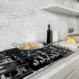 Bosch NGMP059UC gas cooktop cooking fish and vegetables