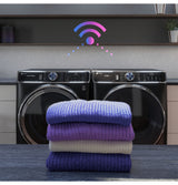GE Profile PFD87GSSVWW gas dryer — laundry room view