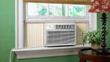 Bevoi BEV18WiNMiD 18,000 BTU window air conditioner installed in a living room window