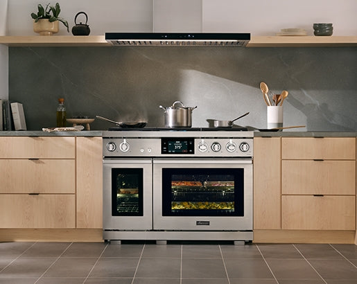 Dacor DHD48U990WM 48 inch hood in transitional kitchen with food