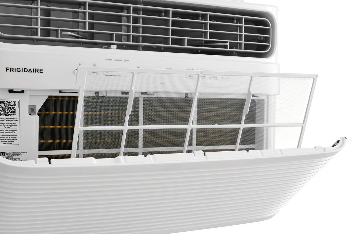Close-up view of a Frigidaire 12,000 BTU Window Room Air Conditioner with Wi-Fi, model FHWV124TE1, with the front panel open to reveal a white, removable mesh air filter. The filter is designed for easy cleaning and maintenance of the AC unit