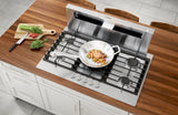 Bosch NGM8659UC gas cooktop in counter with food