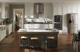 Whirlpool WVI75UC6DS island range hood installed over a kitchen island