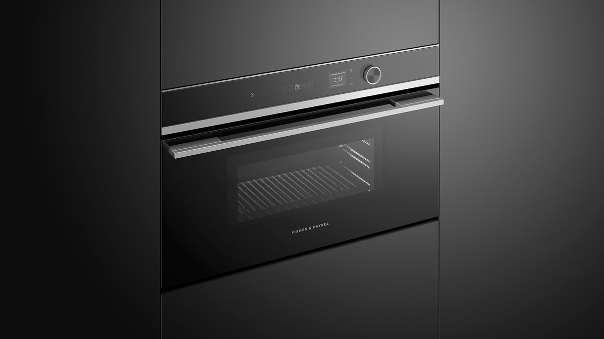 Fisher & Paykel OM30NDLX1 Contemporary Compact Convection-Speed Oven installed in kitchen, lights on