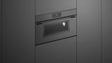 Fisher & Paykel OM30NMUG3 Minimal Compact Convection-Speed Oven installed in kitchen, lights on