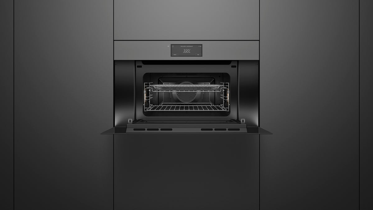 Fisher & Paykel OM30NMUNG3 Minimal Handleless Compact Convection-Speed Oven installed, angled kitchen view