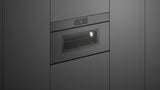 Fisher & Paykel OM30NMUNG3 Minimal Handleless Compact Convection-Speed Oven installed in kitchen, lights on