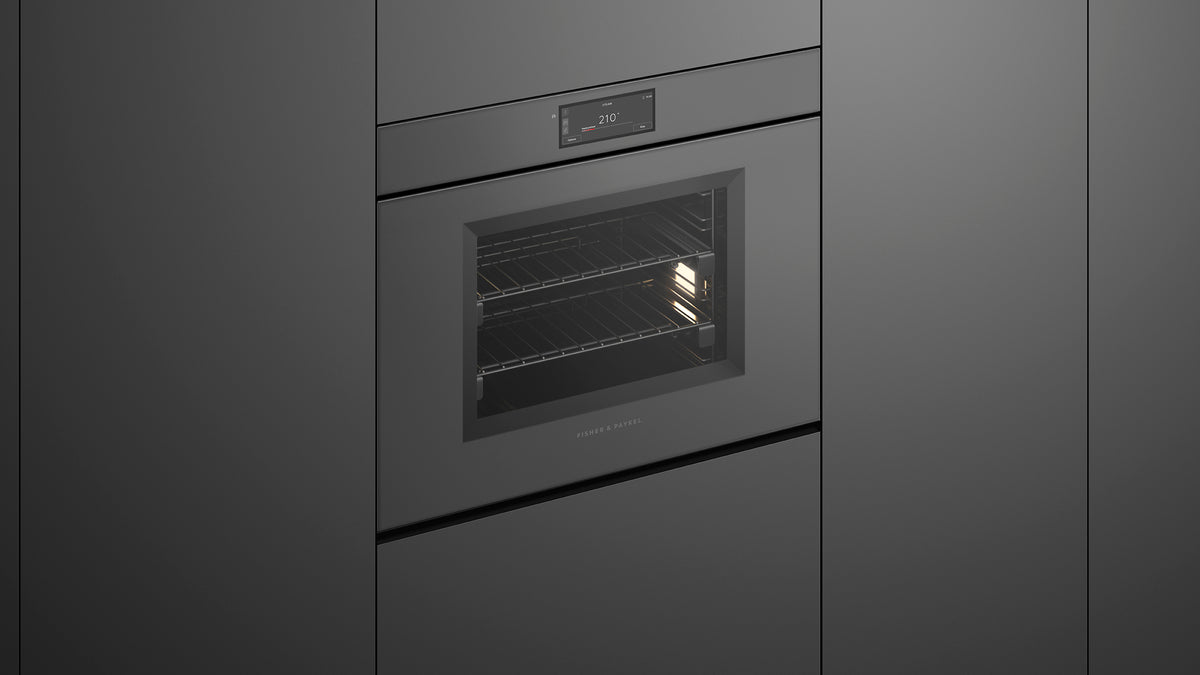 Fisher & Paykel OS30SMUNG3 Minimal Handleless Combi-Steam Oven installed in kitchen, lights on