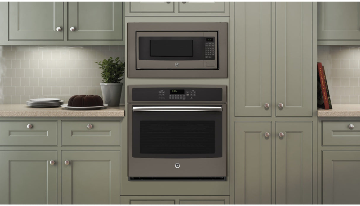 GE JX827EFES Deluxe Built-In Trim Kit Slate installed with microwave