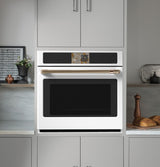 Café CTS90DP4ZW2 single wall oven with door open showing interior racks